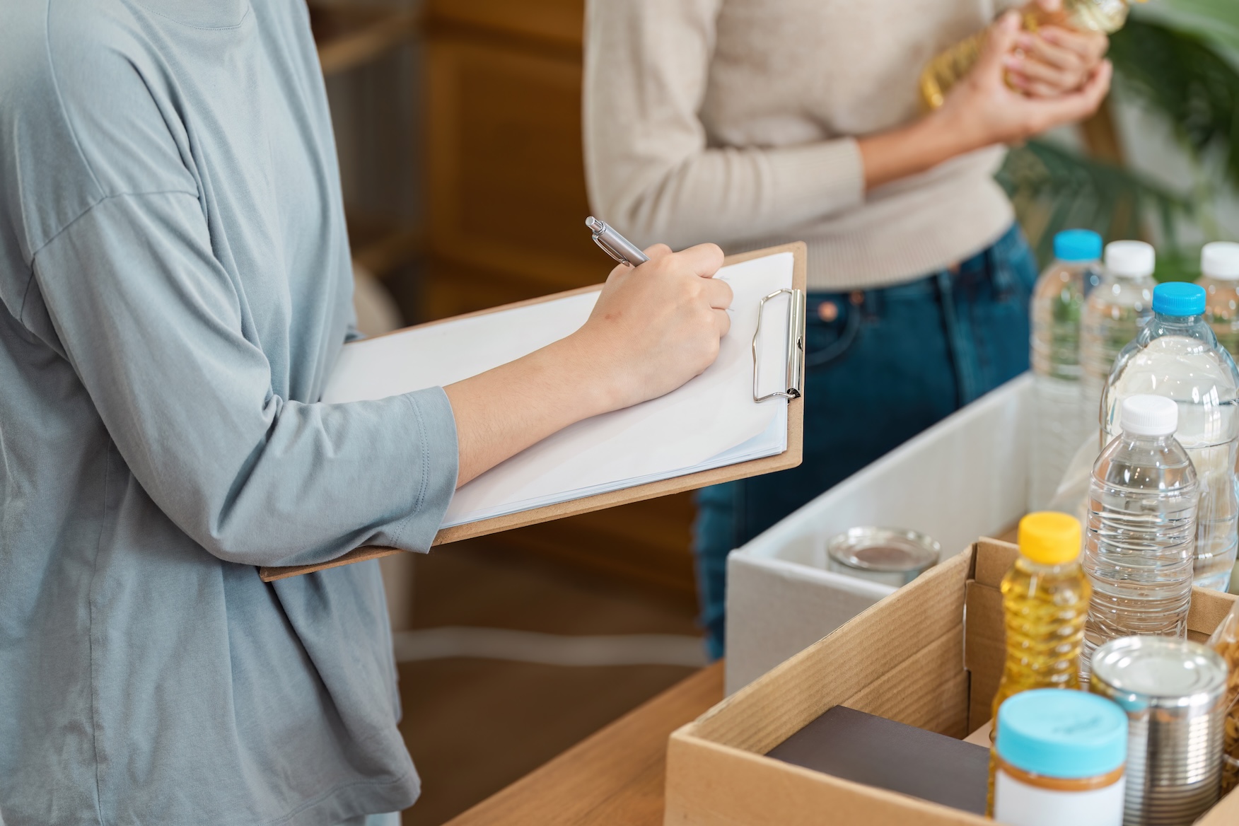 A checklist and certification documents on a desk with food products